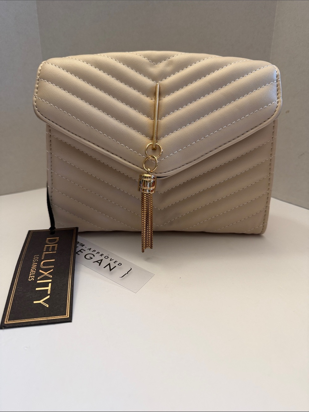 Deluxity Quilted Beige Crossbody Bag with Gold Tassel